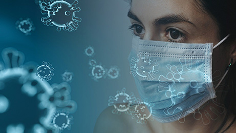 femme avec masque chirurgical et dessins de virus covid